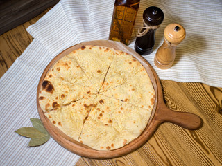 Flat bread with cheese on the tree