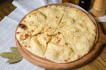 Flat bread with cheese on the tree