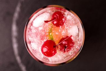 Alcoholic cocktail sour cherry gin or porch crawler. Lemonade.
