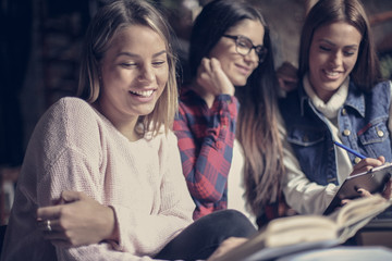 Smiley students girls learning together. Close up.