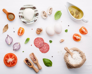 The ingredients for homemade pizza with ingredients sweet basil ,tomato ,garlic ,bay leaves ,pepper...