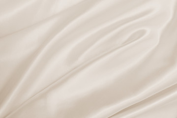 Fototapeta na wymiar Smooth elegant golden silk or satin luxury cloth texture as wedding background
