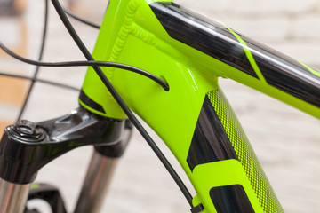 New modern road bicycle on white textured background. Element of a bicycle. Black green bicycle...