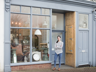 Portrait of small business owner outside store