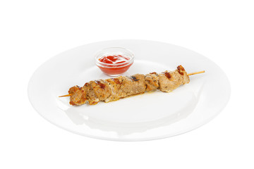 Shish kebab, beef, lamb, pork, chicken grilled meat, barbecue, without side dish on a plate, isolated on white background. Ketchup, tomato, red sauce. Side view For the menu