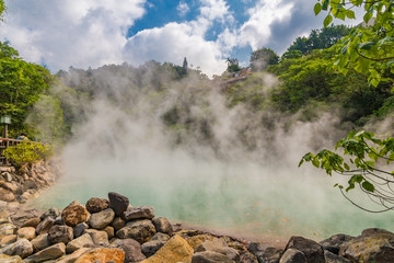 Fototapeta premium Great view of the jade-like hot spring at Beitou Thermal Valley, which is releasing sulphuric steam. The Geothermal Valley is over 80 degrees Celsius hot and is famous for the rare hokutolite rocks.