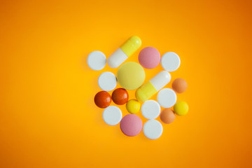  Pills on a bright orange background.  Medicines 