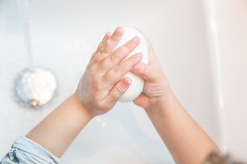 Child washig her hands