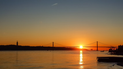 Fototapeta na wymiar Sunset in Portugal against the backdrop of the bridge