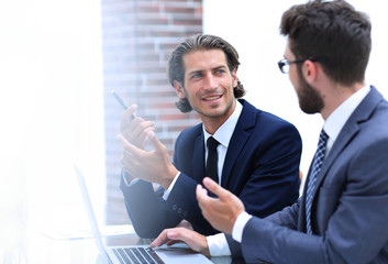 two clerks sitting at their Desk.