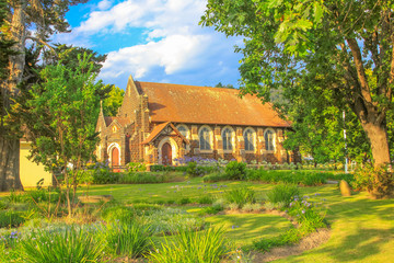 Side view of historic St. Georges Anglican Church in Knysna on the Garden Route in Western Cape, South Africa. The old Church as built in 1855. Sunny day, blue sky.