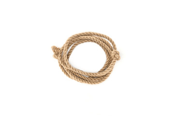 top view of arranged brown marine rope with knots isolated on white