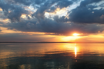 Beautiful fiery sunset sky on the beach. Composition of nature