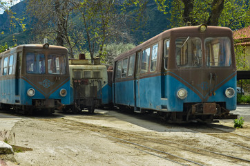 Fototapeta na wymiar KALAVRYTA GREECE, -Old wagons of the Greek railways standing on a station in Kalavryta.