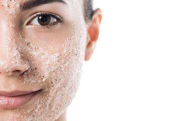 cropped image of beautiful girl with facial scrub looking at camera isolated on white