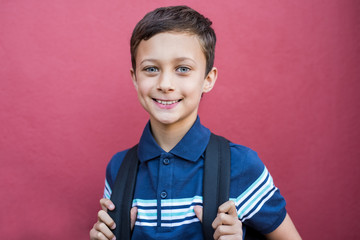 Smiling boy with school bag