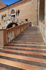 Obraz na płótnie Canvas Verona, Italy - historic city center - Ranaissance stairs Ragione leading to the Palazzo Ragione Palace at the Piazza Erbe Square