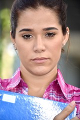 Adult Female Student With Notebooks