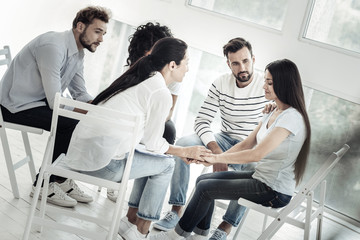 Be optimistic. Nice joyful friendly people sitting together and supporting their fried while feeling sympathetic towards her