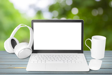 Fototapeta premium Headphones with laptop on table