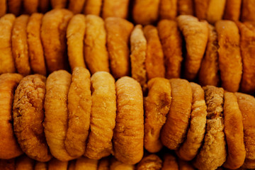 dried figs neatly laid out in a shop window top view