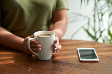 Unrecognizable Woman Enjoying Cappuccino