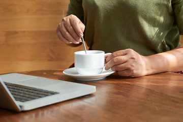 Female Manager Working from Cafe