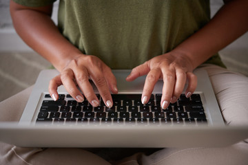 Unrecognizable Woman Using Laptop