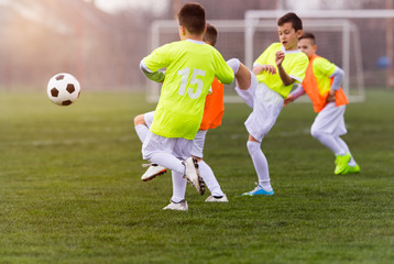 Young children players football match on soccer field