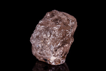 Macro mineral stone smoky quartz Rauch topaz on black background