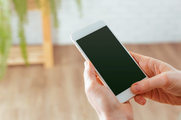close up of woman texting on smartphone