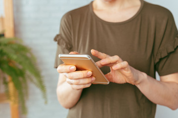close up of woman texting on smartphone