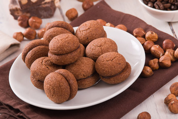 Hazelnut shortbread sandwiches filled with chocolate cream 