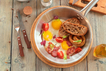 Scrambled eggs on the wooden table