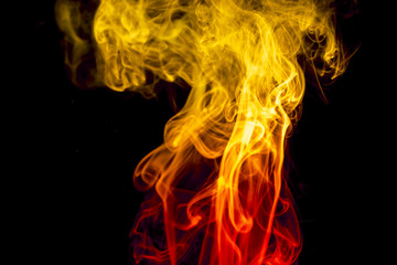 Fototapeta premium Colored smoke on black background
