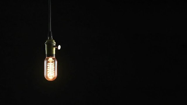 flickering vintage light bulb In the dark