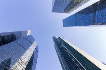 Obraz na płótnie Canvas Business center skyscrapers. Building on sky background. Free space for design and logo