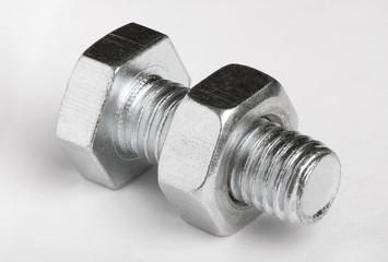 Bolt and nut on white  background.