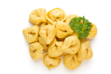 Raw homemade pasta,tortellini with herbs.