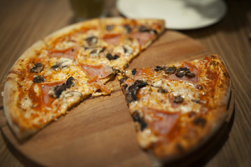 tasty appetizing pizza on a wooden Board