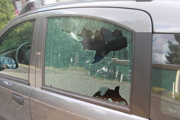 Close Up of a broken car window of a burgular