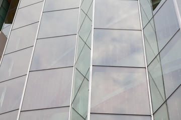 The glass wall on the building.