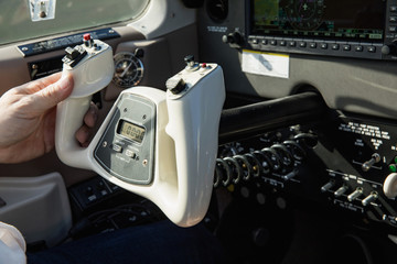Cockpit of small, sport aircraft. A view of a glass cockpit dashboard and knap