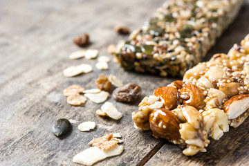 Muesli bars on wooden table. Copyspace