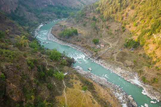Aerial view of small suspension bridge over the Kali Gandaki river between Kushma and Balewa in Nepal