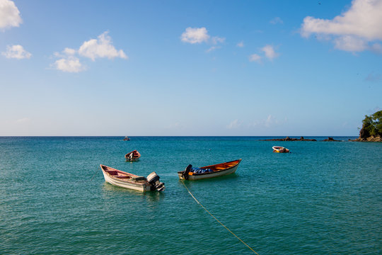 Fishing boats in blue sea on sunny sky in castries, st.lucia. Summer vacation in tropics. Fishing and recreation on tropical island. Travel by boat and wanderlust concept