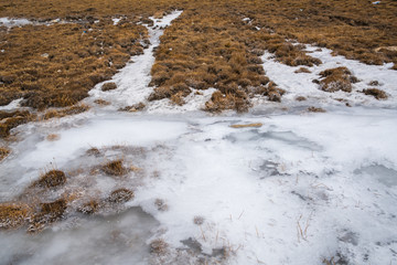 Fototapeta premium Ice Frozen cover on ground and road at ZERO POINT