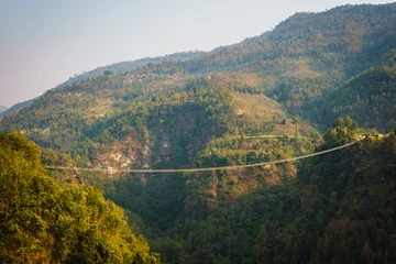 Deurstickers Suspension bridge over the Modi river in Kushma, Nepal © Thomas Dutour