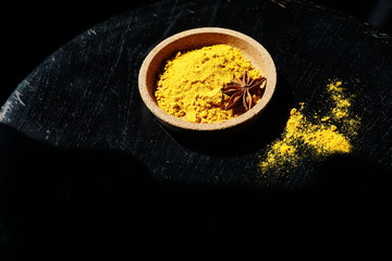 Turmeric powder with star anise. Spice.