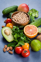 Healthy Food Clean Concept. Raw fruits, Vegetables, Nuts, Cereals on Concrete Stone Table Background.